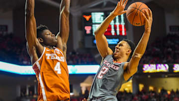 LUBBOCK, TX - JANUARY 31: Zhaire Smith #2 of the Texas Tech Red Raiders goes up for a shot against Nohamed Bamba #4 of the Texas Longhorns during the game on January 31, 2018 at United Supermarket Arena in Lubbock, Texas. Texas Tech defeated Texas 73-71 in overtime. (Photo by John Weast/Getty Images)