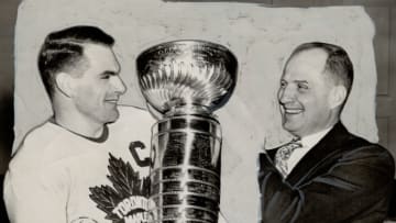 CANADA - APRIL 28: Captain Syl and Coach Hap Day admire the Stanley Cup which the Leafs wrested from CAnadiens. Apps will take time out from his job as commissioner to help leafs defend next N.H.L. campaign, he having reconsidered earlier determination to retire (Photo by Lou Turofsky/Toronto Star via Getty Images)