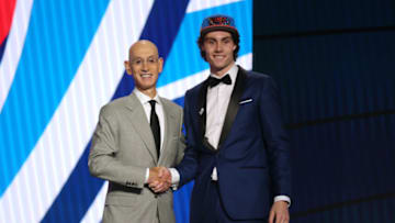 Jul 29, 2021: OKC Thunder rookie Josh Giddey poses with NBA commissioner Adam Silver after being selected as the number six overall pick. Mandatory Credit: Brad Penner-USA TODAY Sports.