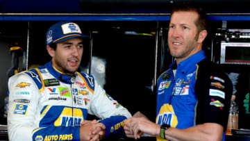 WATKINS GLEN, NEW YORK - AUGUST 03: Chase Elliott, driver of the #9 NAPA AUTO PARTS Chevrolet, stands in the garage with Crew Chief Alan Gustafson during practice for the Monster Energy NASCAR Cup Series Go Bowling at The Glen at Watkins Glen International on August 03, 2019 in Watkins Glen, New York. (Photo by Sean Gardner/Getty Images)