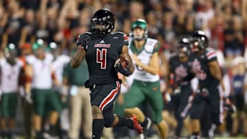 LOUISVILLE, KY - SEPTEMBER 01: Crovin Lamb #4 of the Louisville Cardinals runs for a touchdown on a kick off return during the game against the Miami Huricanesat Papa John's Cardinal Stadium on September 1, 2014 in Louisville, Kentucky. (Photo by Andy Lyons/Getty Images)