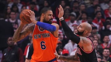 Oct 31, 2013; Chicago, IL, USA; New York Knicks center Tyson Chandler (6) is defended by Chicago Bulls power forward Carlos Boozer (5) during the first quarter at United Center. Mandatory Credit: Dennis Wierzbicki-USA TODAY Sports