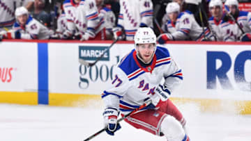 MONTREAL, QC - FEBRUARY 27: Tony DeAngelo #77 of the New York Rangers skates the puck against the Montreal Canadiens during the first period at the Bell Centre on February 27, 2020 in Montreal, Canada. The New York Rangers defeated the Montreal Canadiens 5-2. (Photo by Minas Panagiotakis/Getty Images)