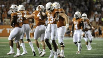 Sep 12, 2015; Austin, TX, USA; Texas Longhorns quarterback Jerrod Heard (13) reacts against the Rice Owls during the third quarter at Darrell K Royal-Texas Memorial Stadium. Texas beat Rice 42-28. Mandatory Credit: Brendan Maloney-USA TODAY Sports