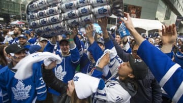 TORONTO, ON - APRIL 12: Fans parade around a makeshift replica of the Stanley Cup, this one fashioned from beer cans. Toronto Maple Leaf fans gather at Maple Leaf Square, outside the Air Canada Centre, for the 1st game of the playoffs between Toronto and Boston Bruins. (Rick Madonik/Toronto Star via Getty Images)