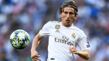 Real Madrid's Croatian midfielder Luka Modric eyes the ball during the UEFA Champions league Group A football match between Real Madrid and Club Brugge at the Santiago Bernabeu stadium in Madrid on October 1, 2019. (Photo by OSCAR DEL POZO / AFP) (Photo credit should read OSCAR DEL POZO/AFP/Getty Images)
