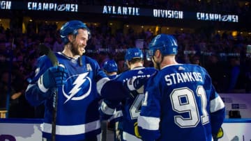 TAMPA, FL - MARCH 18: Victor Hedman #77 of the Tampa Bay Lightning celebrates with Steven Stamkos #91 after defeating the Arizona Coyotes 4-1 to win the Atlantic Division and the President's Trophy at Amalie Arena on March 18, 2019 in Tampa, Florida. (Photo by Scott Audette/NHLI via Getty Images)