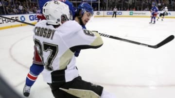 May 5, 2014; New York, NY, USA; Pittsburgh Penguins center Sidney Crosby (87) is hit by New York Rangers right wing Mats Zuccarello (36) during the second period of game three of the second round of the 2014 Stanley Cup Playoffs at Madison Square Garden. The Penguins defeated the Rangers 2-0 and now lead the series 2-1. Mandatory Credit: Brad Penner-USA TODAY Sports