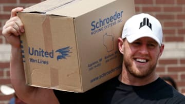 HOUSTON, TX - SEPTEMBER 3: (AFP OUT) Houston Texans defensive end J.J. Watt holds a box of relief supplies on his shoulder while handing them out to people impacted by Hurricane Harvey on September 3, 2017, in Houston, Texas. Watt's Hurricane Harvey Relief Fund has raised more than $18 million to date to help those affected by the storm. (Photo by Brett Coomer - Pool/Getty Images)