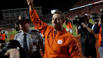 RALEIGH, NC - NOVEMBER 04: Head coach Dabo Swinney of the Clemson Tigers celebrates after defeating the North Carolina State Wolfpack 38-31 at Carter Finley Stadium on November 4, 2017 in Raleigh, North Carolina. (Photo by Streeter Lecka/Getty Images)
