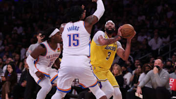 Anthony Davis #3 of the Los Angeles Lakers attempts a shot in front of Derrick Favors #15 and Luguentz Dort #5 of the Oklahoma City Thunder during a 107-104 Oklahoma City Thunder win at Staples Center on November 04, 2021 in Los Angeles, California. (Photo by Harry How/Getty Images)