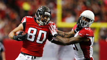 ATLANTA, GA - NOVEMBER 27: Levine Toilolo #80 of the Atlanta Falcons breaks a tackle by Patrick Peterson #21 of the Arizona Cardinals after a catch during the second half at the Georgia Dome on November 27, 2016 in Atlanta, Georgia. (Photo by Kevin C. Cox/Getty Images)