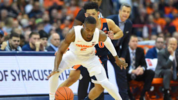SYRACUSE, NY - NOVEMBER 06: Jalen Carey #5 of the Syracuse Orange reacts to a loose ball in front of Kihei Clark #0 of the Virginia Cavaliers during the first half at the Carrier Dome on November 6, 2019 in Syracuse, New York. (Photo by Rich Barnes/Getty Images)