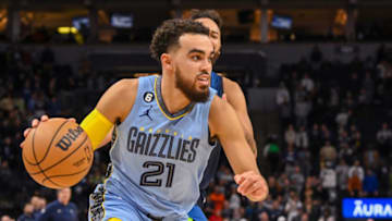 Nov 30, 2022; Minneapolis, Minnesota, USA; Memphis Grizzlies guard Tyus Jones (21) drives to the basket against the Minnesota Timberwolves during the fourth quarter at Target Center. Mandatory Credit: Nick Wosika-USA TODAY Sports