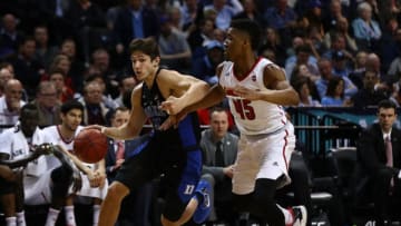 NEW YORK, NY - MARCH 09: Grayson Allen #3 of the Duke Blue Devils drives aginst Donovan Mitchell #45 of the Louisville Cardinals during the Quarterfinals of the ACC Basketball Tournament at the Barclays Center on March 9, 2017 in New York City. (Photo by Al Bello/Getty Images)