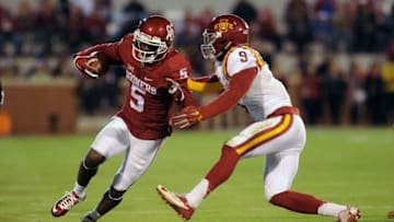 Nov 7, 2015; Norman, OK, USA; Oklahoma Sooners wide receiver Durron Neal (5) is tackled by Iowa State Cyclones linebacker Reggan Northrup (9) during the second quarter at Gaylord Family - Oklahoma Memorial Stadium. Mandatory Credit: Mark D. Smith-USA TODAY Sports