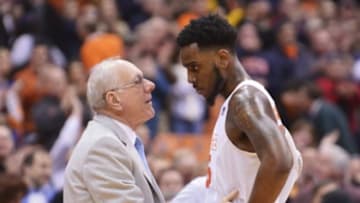 Mar 2, 2015; Syracuse, NY, USA; Syracuse Orange head coach Jim Boeheim congratulates forward Rakeem Christmas (25) for his efforts near the end of a game against the Virginia Cavaliers at the Carrier Dome. Virginia won the game 59-47. Mandatory Credit: Mark Konezny-USA TODAY Sports