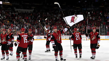 GLENDALE, ARIZONA - OCTOBER 10: Christian Fischer #36 of the Arizona Coyotes and teammates acknowledge the crowd following a 4-1 victory against the Vegas Golden Knights at Gila River Arena on October 10, 2019 in Glendale, Arizona. (Photo by Norm Hall/NHLI via Getty Images)
