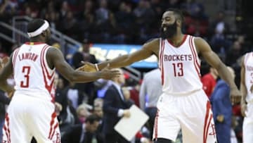 Dec 29, 2015; Houston, TX, USA; Houston Rockets guard James Harden (13) celebrates with guard Ty Lawson (3) after making a basket during the first quarter against the Atlanta Hawks at Toyota Center. Mandatory Credit: Troy Taormina-USA TODAY Sports