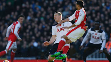 TOPSHOT - Tottenham Hotspur's Austrian defender Kevin Wimmer (L) fouls Arsenal's French midfielder Francis Coquelin, resulting in a yellow card, during the English Premier League football match between Arsenal and Tottenham Hotspur at the Emirates Stadium in London on November 6, 2016. / AFP / IKIMAGES / RESTRICTED TO EDITORIAL USE. No use with unauthorized audio, video, data, fixture lists, club/league logos or 'live' services. Online in-match use limited to 45 images, no video emulation. No use in betting, games or single club/league/player publications. (Photo credit should read IKIMAGES/AFP/Getty Images)