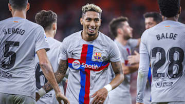 BILBAO, SPAIN - MARCH 12: Raphinha (22) of Barcelona celebrates with teammates after scoring a goal during La Liga week 25 match between Athletic Bilbao and Barcelona at San Mames Stadium in Bilbao, Spain on March 12, 2023. (Photo by Pablo Garcia Sacristan/Anadolu Agency via Getty Images)