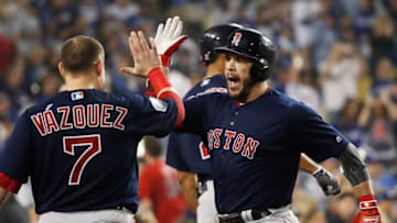 LOS ANGELES, CA - OCTOBER 28: Steve Pearce #25 of the Boston Red Sox is congratulated by his teammate Christian Vazquez #7 after his eighth inning home run against the Los Angeles Dodgers in Game Five of the 2018 World Series at Dodger Stadium on October 28, 2018 in Los Angeles, California. (Photo by Sean M. Haffey/Getty Images)
