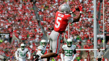 Ohio State Buckeyes wide receiver Garrett Wilson (5) catches a long pass from Ohio State Buckeyes quarterback C.J. Stroud (7) during Saturday's NCAA Division I football game against the Oregon Ducks at Ohio Stadium in Columbus on September 11, 2021.Osu21ore Bjp 35
