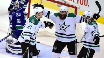 Nov 13, 2016; Vancouver, British Columbia, CAN; Dallas Stars forward Antoine Roussel (21) celebrates his goal against Vancouver Canucks goaltender Ryan Miller (30) during the third period at Rogers Arena. The Vancouver Canucks won 5-4 in overtime. Mandatory Credit: Anne-Marie Sorvin-USA TODAY Sports
