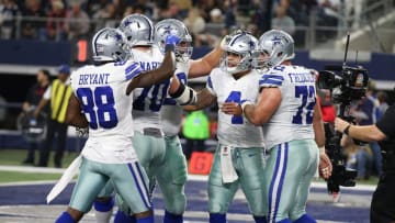Dec 18, 2016; Arlington, TX, USA; Dallas Cowboys quarterback Dak Prescott (4) celebrates his second quarter touchdown with teammates against the Tampa Bay Buccaneers at AT&T Stadium. Mandatory Credit: Matthew Emmons-USA TODAY Sports