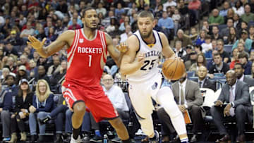 Dec 23, 2016; Memphis, TN, USA; Memphis Grizzlies forward Chandler Parsons (25) drives against Houston Rockets forward Trevor Ariza (1) during the first half at FedExForum. Mandatory Credit: Nelson Chenault-USA TODAY Sports