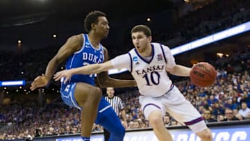 OMAHA, NE - MARCH 25: Kansas guard Sviatoslav Mykhailiuk (10) drives on Duke forward Wendell Carter Jr (34) in the fourth round of the 2018 NCAA Men's Basketball Tournament held at CenturyLink Center on March 25, 2018 in Omaha, Nebraska. (Photo by David Klutho/NCAA Photos via Getty Images)