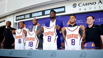 PHOENIX, AZ - JUNE 22: James Jones, George King, Mikal Bridges, Deandre Ayton, Elie Okobo, and General Manager Ryan McDonough of the Phoenix Suns pose together during a press conference on June 22, 2018, at Talking Stick Resort Arena in Phoenix, Arizona. NOTE TO USER: User expressly acknowledges and agrees that, by downloading and or using this Photograph, user is consenting to the terms and conditions of the Getty Images License Agreement. Mandatory Copyright Notice: Copyright 2018 NBAE (Photo by Michael Gonzales/NBAE via Getty Images)