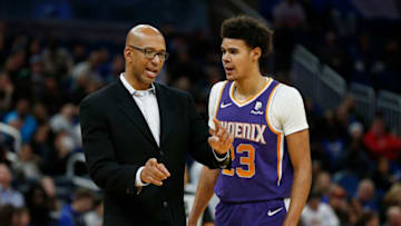 Head coach Monty Williams of the Phoenix Suns talks with Cameron Johnson #23 (Photo by Michael Reaves/Getty Images)