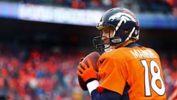 Jan 11, 2015; Denver, CO, USA; Indianapolis Colts quarterback Peyton Manning (18) walks off the field after the NFL divisional playoff game against the Denver Broncos at Sports Authority Field at Mile High Stadium. The Colts defeated the Broncos 24-13. Mandatory Credit: Kirby Lee-USA TODAY Sports