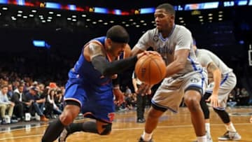 Feb 6, 2015; Brooklyn, NY, USA; New York Knicks forward Carmelo Anthony (7) drives to the basket past Brooklyn Nets forward Joe Johnson (7) during the first quarter at Barclays Center. Mandatory Credit: Adam Hunger-USA TODAY Sports
