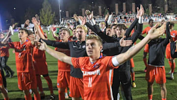 Clemson midfielder Brandon Parrish celebrates with the team and fans after time expired in the round of 32 NCAA Men's Soccer Championships, at Historic Riggs Field in Clemson, S.C. Sunday, November 19, 2023. Clemson beat Charlotte 3-0 and advance to the sweet 16.