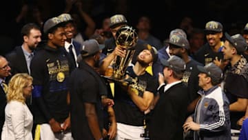 CLEVELAND, OH - JUNE 08: Stephen Curry #30 of the Golden State Warriors celebrates with the Larry O'Brien Trophy after defeating the Cleveland Cavaliers during Game Four of the 2018 NBA Finals at Quicken Loans Arena on June 8, 2018 in Cleveland, Ohio. The Warriors defeated the Cavaliers 108-85 to win the 2018 NBA Finals. NOTE TO USER: User expressly acknowledges and agrees that, by downloading and or using this photograph, User is consenting to the terms and conditions of the Getty Images License Agreement. (Photo by Justin K. Aller/Getty Images)
