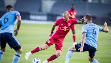 BRONX, NY - JULY 08: Daniel Royer #77 of New York Red Bulls looks for the opening against Maxime Chanot #4 of New York City and Alexander Callens #6 of New York City during the Major League Soccer Hudson River Derby match between New York City FC and New York Red Bulls at Yankee Stadium on July 8, 2018 in the Bronx borough of New York. New York City FC won the match with a score of 1 to 0. (Photo by Ira L. Black/Corbis via Getty Images)