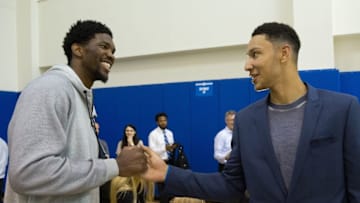 Jun 24, 2016; Philadelphia, PA, USA; Philadelphia 76ers number one overall draft pick Ben Simmons (R) is greeted by center Joel Embiid (L) during a press conference at the Philadelphia College Of Osteopathic Medicine. Mandatory Credit: Bill Streicher-USA TODAY Sports