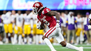 ATLANTA, GA - DECEMBER 28: CeeDee Lamb #2 of the Oklahoma Sooners rushes with the ball during the Chick-fil-A Peach Bowl against the LSU Tigers at Mercedes-Benz Stadium on December 28, 2019 in Atlanta, Georgia. (Photo by Carmen Mandato/Getty Images)