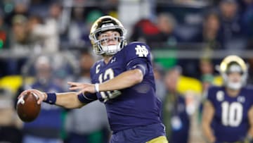 SOUTH BEND, IN - OCTOBER 12: Ian Book #12 of the Notre Dame Fighting Irish throws a pass against the USC Trojans in the first half of the game at Notre Dame Stadium on October 12, 2019 in South Bend, Indiana. (Photo by Joe Robbins/Getty Images)