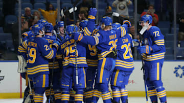Oct 16, 2021; Buffalo, New York, USA; The Buffalo Sabres celebrate a shootout win over the Arizona Coyotes at KeyBank Center. Mandatory Credit: Timothy T. Ludwig-USA TODAY Sports