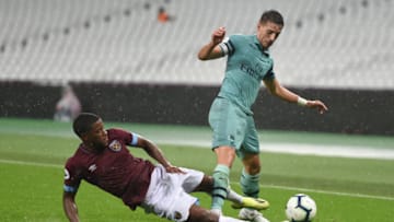 LONDON, ENGLAND - AUGUST 24: Xande Silva of West Ham United fouls Julio Pleguezuelo of Arsenal during the Premier League 2 game between West Ham United and Arsenal at London Stadium on August 24, 2018 in London, England. (Photo by Harriet Lander/Getty Images)