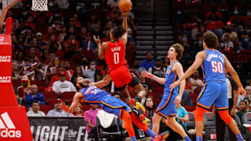 Jalen Green #0 of the Houston Rockets drives to the basket while defended by Kenrich Williams #34 of the Oklahoma City Thunder in the second half at Toyota Center on October 22, 2021 in Houston, Texas. (Photo by Tim Warner/Getty Images)