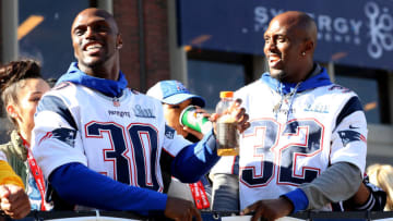 BOSTON, MASSACHUSETTS - FEBRUARY 05: Jason McCourty #30 of the New England Patriots and Devin McCourty #32 celebrate on Cambridge street during the New England Patriots Victory Parade on February 05, 2019 in Boston, Massachusetts. (Photo by Maddie Meyer/Getty Images)