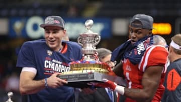 Jan 1, 2016; New Orleans, LA, USA; Mississippi Rebels quarterback Chad Kelly and Mississippi Rebels wide receiver Laquon Treadwell (1) hold the trophy at the end of the 2016 Sugar Bowl at the Mercedes-Benz Superdome. Mississippi defeated the Oklahoma State Cowboys, 48-20. Mandatory Credit: Chuck Cook-USA TODAY Sports