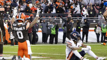 Dec 17, 2023; Cleveland, Ohio, USA; Cleveland Browns cornerback Greg Newsome II (0) celebrates the team’s win as Chicago Bears wide receiver Darnell Mooney (11) sits near him following a missed catch for the final play of the game at Cleveland Browns Stadium. Mandatory Credit: Scott Galvin-USA TODAY Sports