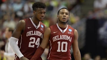 March 26, 2016; Anaheim, CA, USA; Oklahoma Sooners guard Buddy Hield (24) speaks to guard Jordan Woodard (10) during a stoppage in play against Oregon Ducks during the second half of the West regional final of the NCAA Tournament at Honda Center. Mandatory Credit: Richard Mackson-USA TODAY Sports