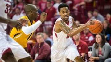 Feb 20, 2016; Fayetteville, AR, USA; Arkansas Razorbacks guard Anthlon Bell (5) drives to the basket around Missouri Tigers guard Terrence Phillips (1) in the first half at Bud Walton Arena. The Razorbacks won 84-72. Mandatory Credit: Gunnar Rathbun-USA TODAY Sports