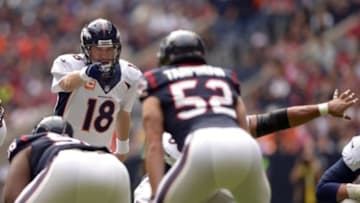 Dec 22, 2013; Houston, TX, USA; Denver Broncos quarterback Peyton Manning (18) directs the offense against the Houston Texans during the first half at Reliant Stadium. Mandatory Credit: Thomas Campbell-USA TODAY Sports